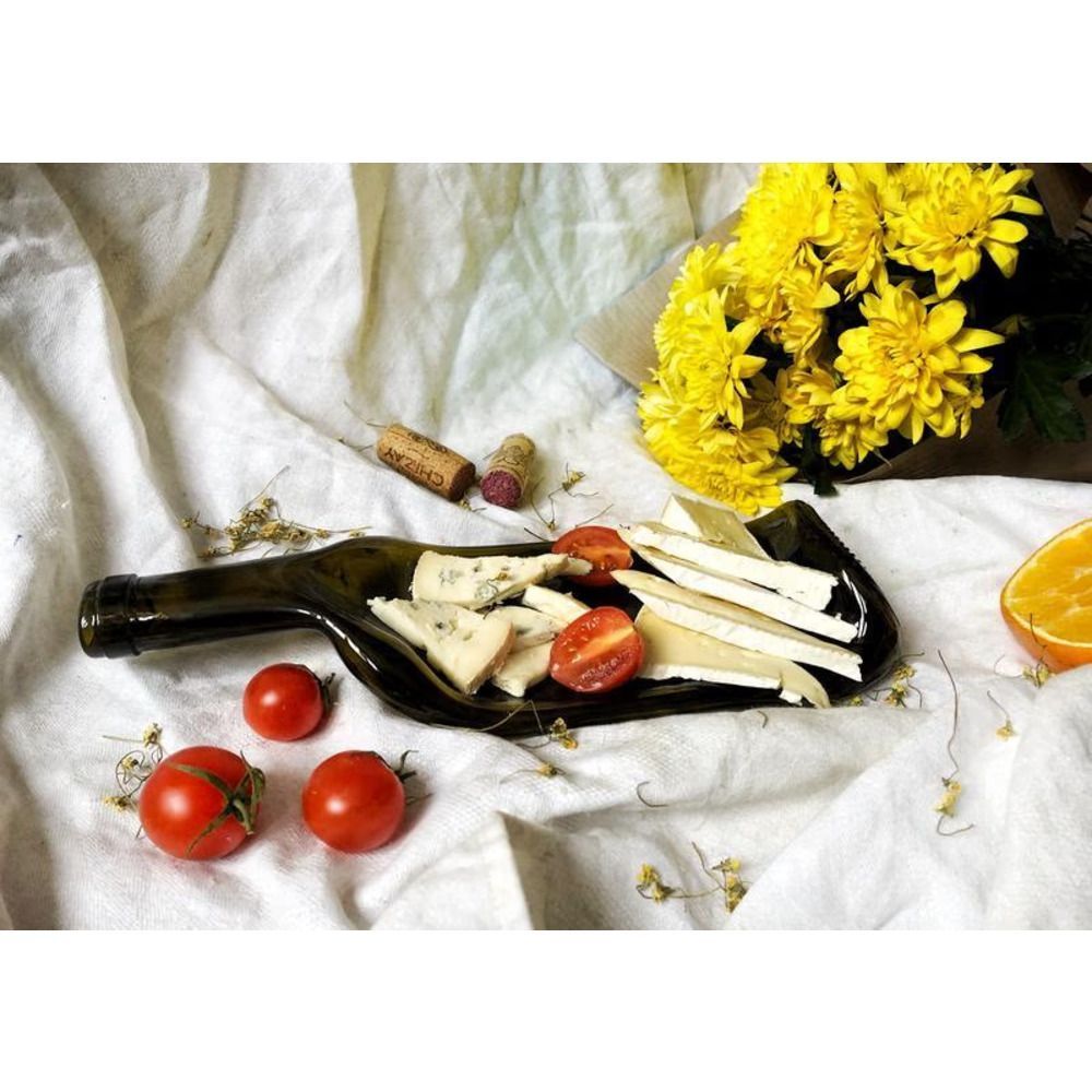 An unusual shaped glass snack plate made from a used and salvaged glass recycled bottle Lay Bottle 17270-lay-bottle photo
