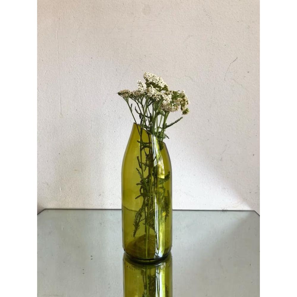 A stylish glass vase with a bottle of wine Lay Bottle 17273-lay-bottle photo