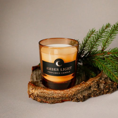 Scented candle "Amber Light" in an orange glass by Herbalcraft Herbalcraft 14291-herbalcraft photo