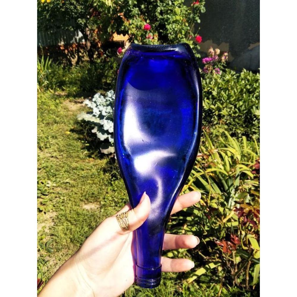 A blue glass plate from a recycled Champagne Blue bottle for snacks, cuts Lay Bottle 17285-lay-bottle photo
