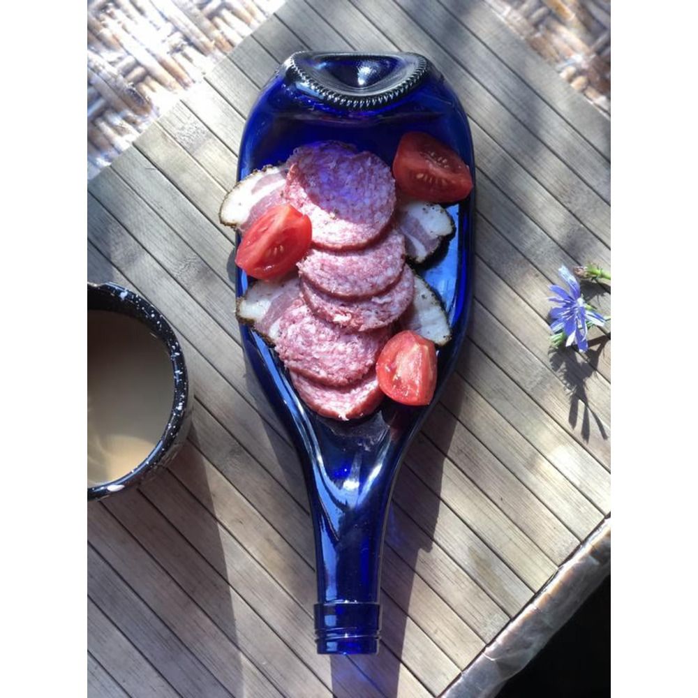 A blue glass plate from a recycled Champagne Blue bottle for snacks, cuts Lay Bottle 17285-lay-bottle photo