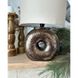Ceramic table lamp on a brown shaped base in the shape of a bagel and a fabric lampshade 11887-yekeramika photo 3