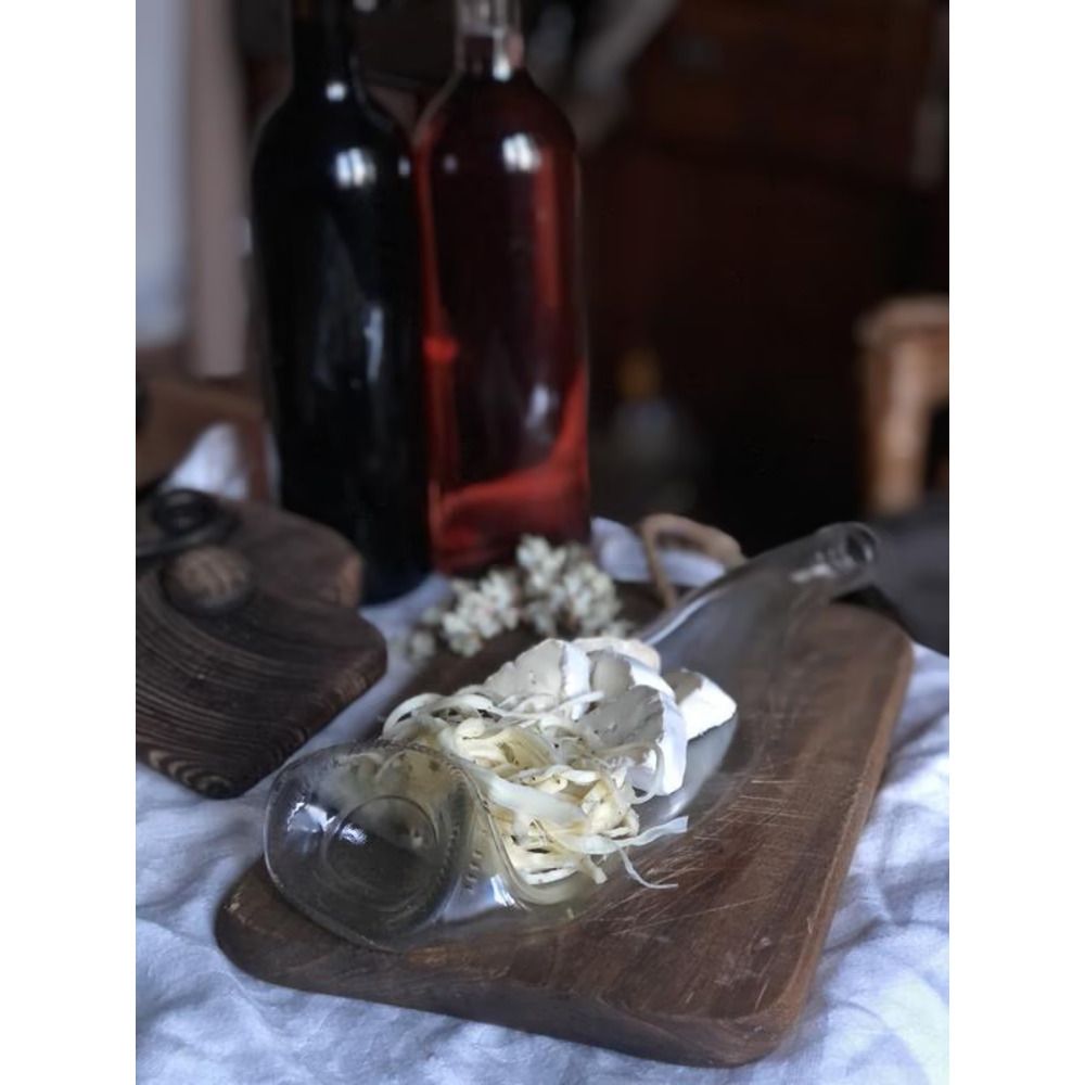 Stylish serving of cheese on a baked champagne bottle from a used and salvaged glass bottle Lay Bottle 17253-lay-bottle photo